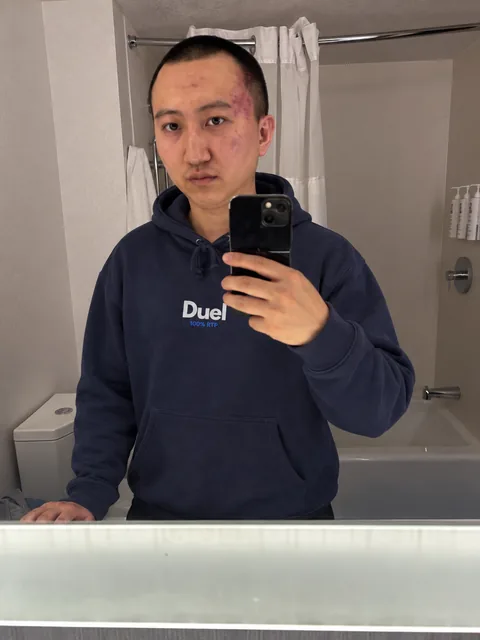 Duel navy hoodie, worn — mirror selfie